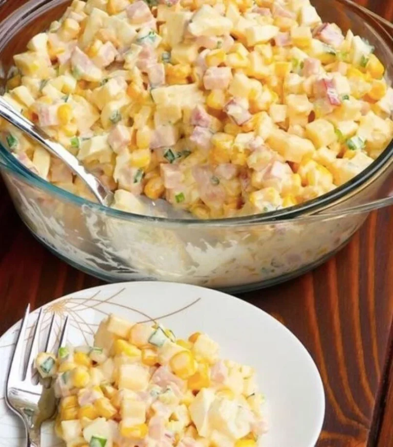 Colorful bowl of Eat Me Stupid Salad filled with fresh greens and veggies.