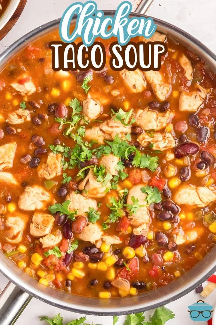 Delicious bowl of chicken taco soup garnished with avocado and cilantro