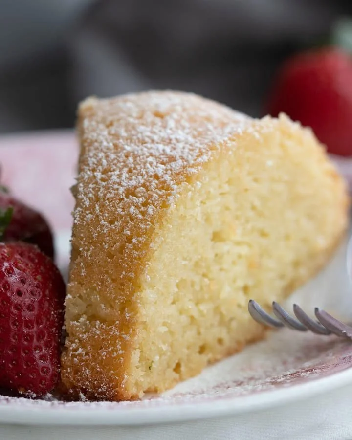 A slice of moist Keto Kentucky Butter Cake topped with a buttery glaze.