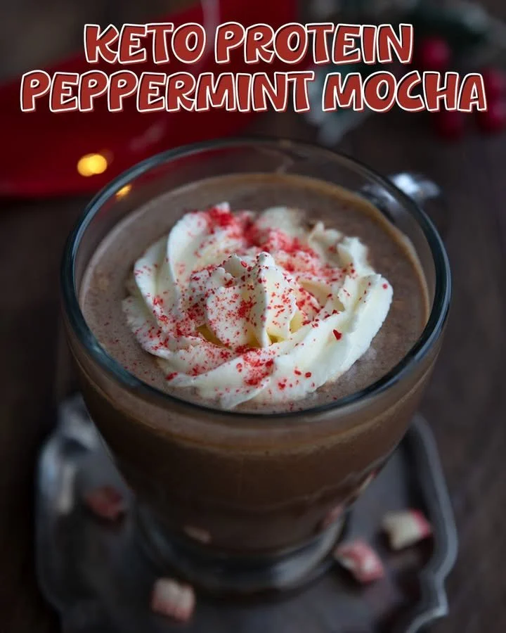 Keto Peppermint Protein Mocha in a festive mug with sprinkles of peppermint